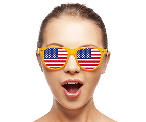 Image showing happy teenage girl in shades with american flag