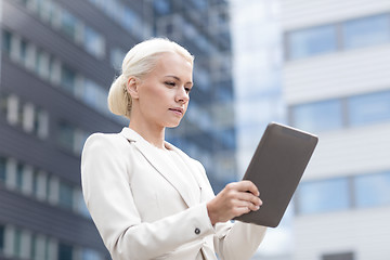 Image showing businesswoman working with tablet pc outdoors
