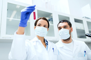 Image showing young scientists making test or research in lab