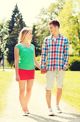 Image showing smiling couple walking in park