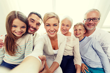 Image showing happy family making selfie at home