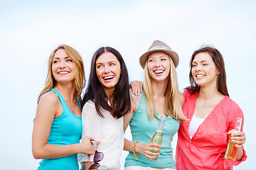 Image showing girls with drinks on the beach