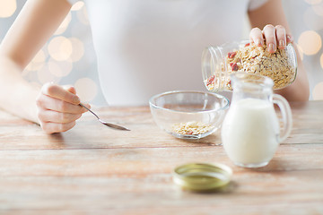 Image showing close up of woman eating muesli for breakfast