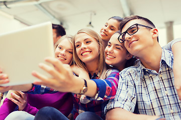 Image showing group of smiling students with tablet pc