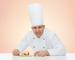 Image showing happy male chef cook with dessert