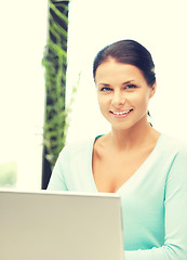 Image showing happy woman with laptop computer