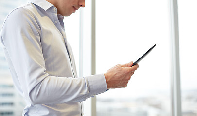 Image showing businessman with tablet pc in office