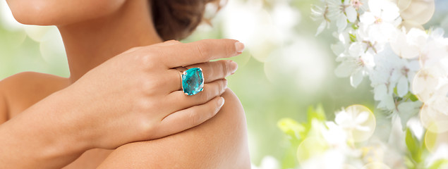 Image showing close up of woman with cocktail ring on hand