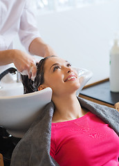 Image showing happy young woman at hair salon