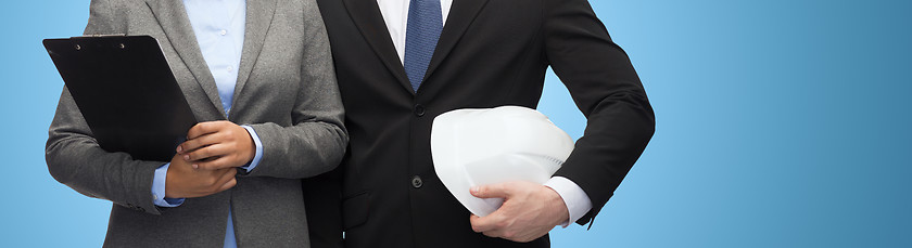 Image showing businesspeople with clipboard and helmet