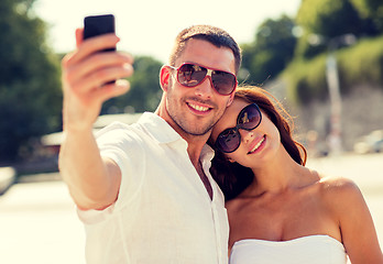 Image showing smiling couple in city