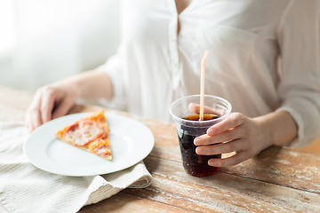 Image showing close up of woman with pizza and coca cola drink