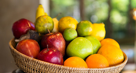 Image showing basket of fresh ripe juicy fruits at kitchen