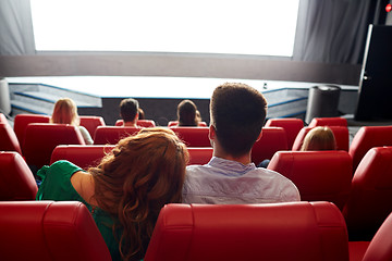 Image showing happy couple watching movie in theater or cinema