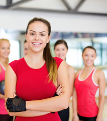 Image showing woman standing in front of the group in gym