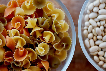 Image showing close up of pasta and beans in glass bowl on table