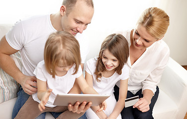 Image showing happy family with tablet pc and credit card