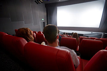 Image showing happy couple watching movie in theater or cinema