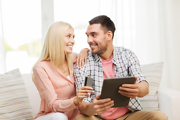 Image showing happy couple with tablet pc and credit card