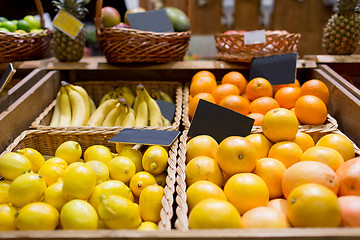 Image showing fruits in baskets with nameplates at food market