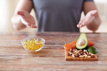 Image showing close up of male hands with food rich in protein