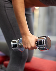 Image showing close up of couple with dumbbell exercising in gym