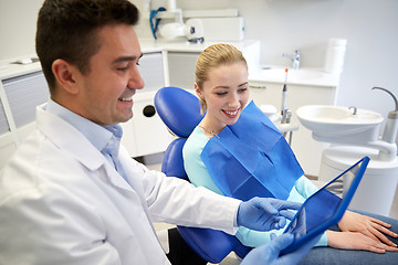 Image showing male dentist with tablet pc and woman patient