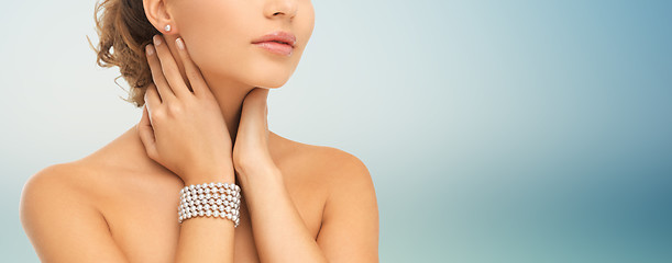 Image showing beautiful woman with pearl earrings and bracelet