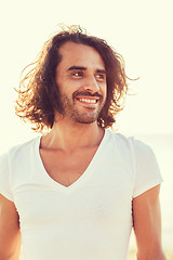 Image showing smiling man in white blank shirt outdoors