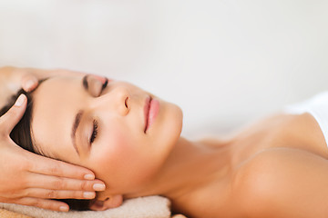 Image showing beautiful woman in spa salon having facial