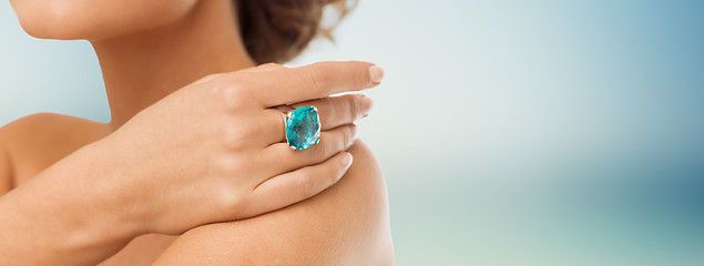 Image showing close up of woman with cocktail ring on hand