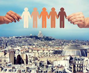 Image showing hands holding paper chain multiracial people