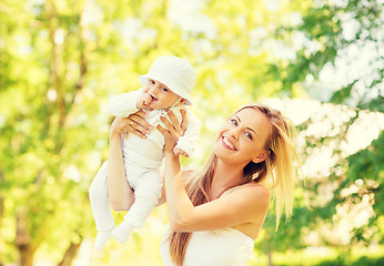 Image showing happy mother with little baby in park