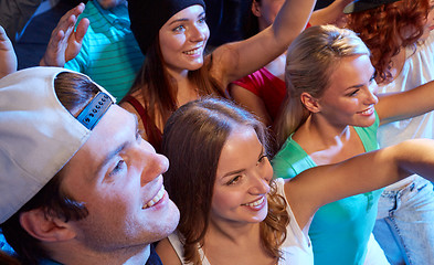 Image showing smiling friends at concert in club