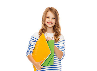 Image showing child holding colorful folders