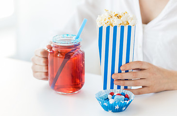 Image showing woman with popcorn and drink in glass mason jar