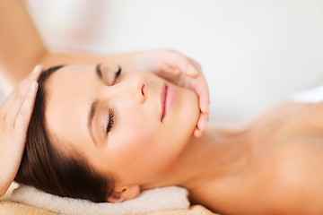 Image showing beautiful woman in spa salon having facial