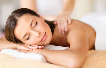 Image showing beautiful woman in spa salon getting massage