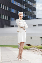 Image showing young smiling businesswoman with crossed arms