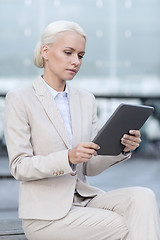 Image showing businesswoman working with tablet pc outdoors