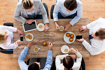 Image showing close up of business team drinking coffee on lunch