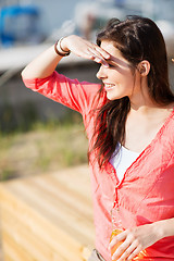 Image showing girl with drink on the beach