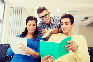 Image showing group of smiling students in lecture hall