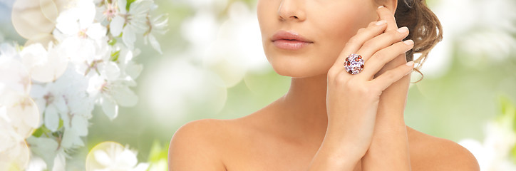 Image showing close up of woman with cocktail ring on hand