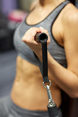 Image showing close up of woman exercising on gym machine