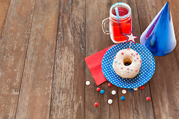 Image showing donut with juice and candies on independence day