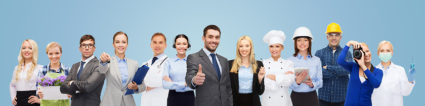 Image showing happy businessman over professional workers