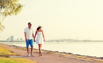 Image showing smiling couple walking outdoors