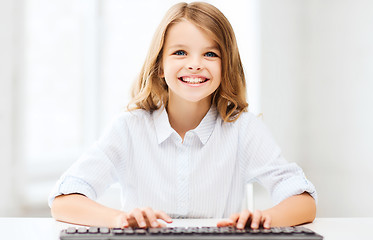 Image showing student girl with keyboard