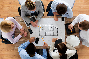 Image showing close up of business team sitting at table